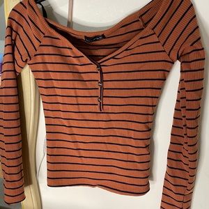 Orange and Navy striped shirt.